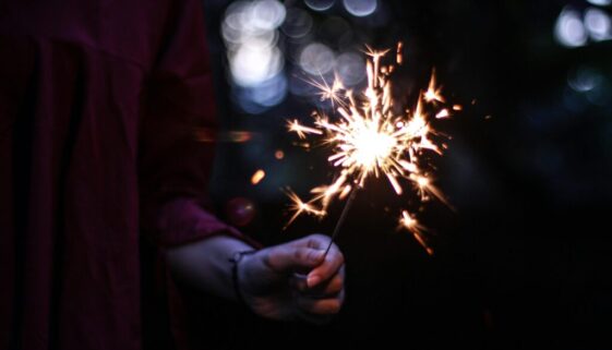 A sparkler lit up in the dark.